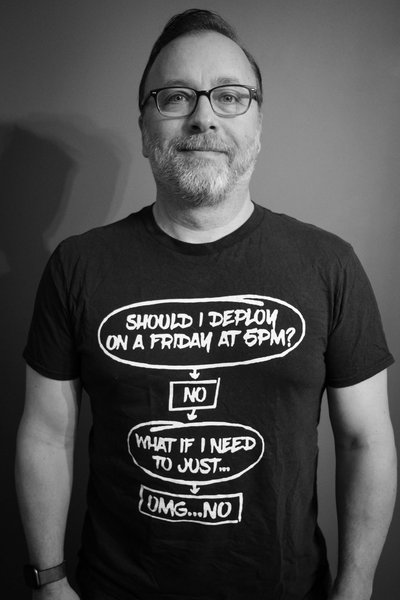 Me in T-Shirt with a flowchart that reads "Should I deploy on a Friday at 5PM?" NO "What if I need to just...?" OMG...NO