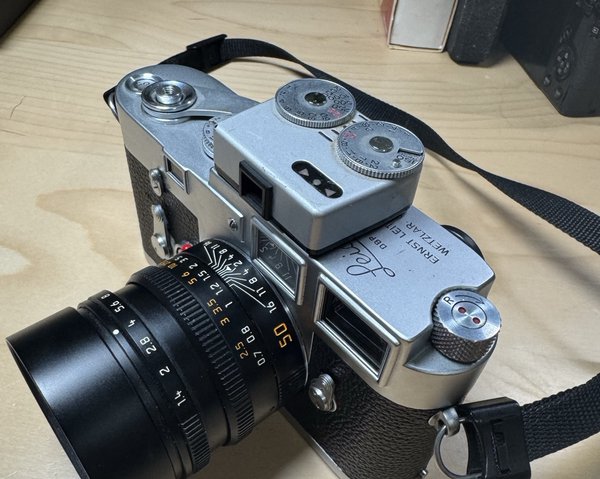 A Leica M3 with a light meter in the cold shoe